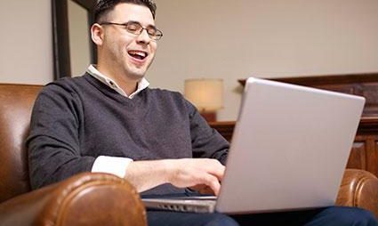 man-laughing-at-computer